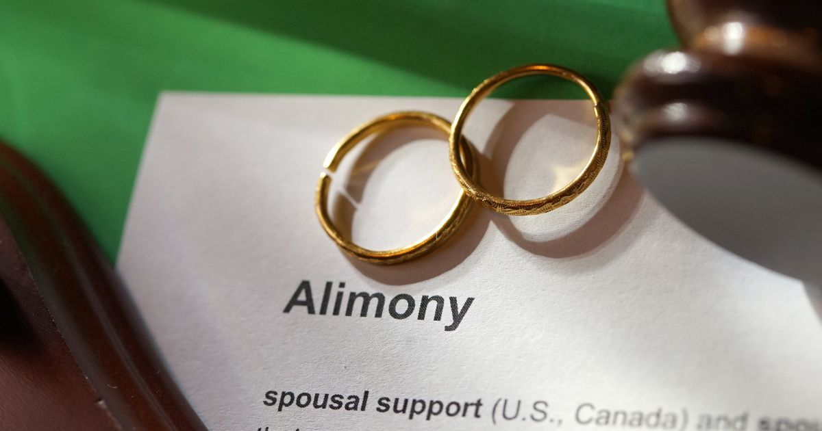 Alimony paperwork and wedding rings