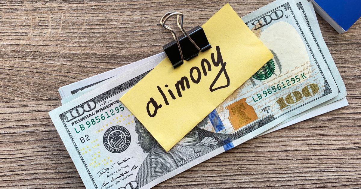 Money with alimony label clipped to it