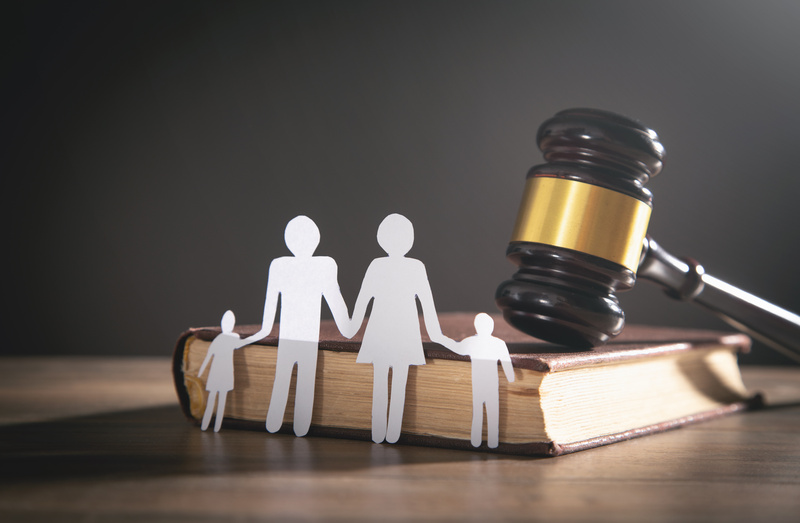 Paper cut family, judge gavel and book. - Alimony and family law concept